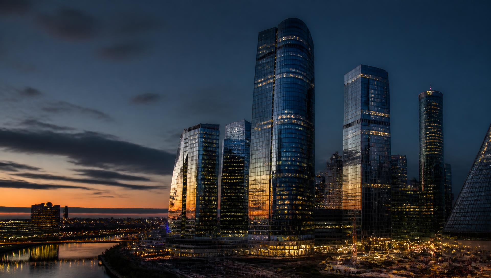 City skyline at dusk representing local business growth